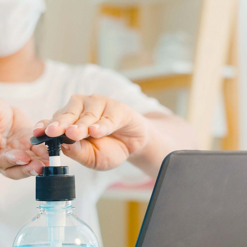 asian-woman-using-alcohol-gel-hand-sanitizer-wash-hand-before-open-laptop-protect-coronavirus-female-push-alcohol-clean-hygiene-when-social-distancing-stay-home-self-quarantine-time